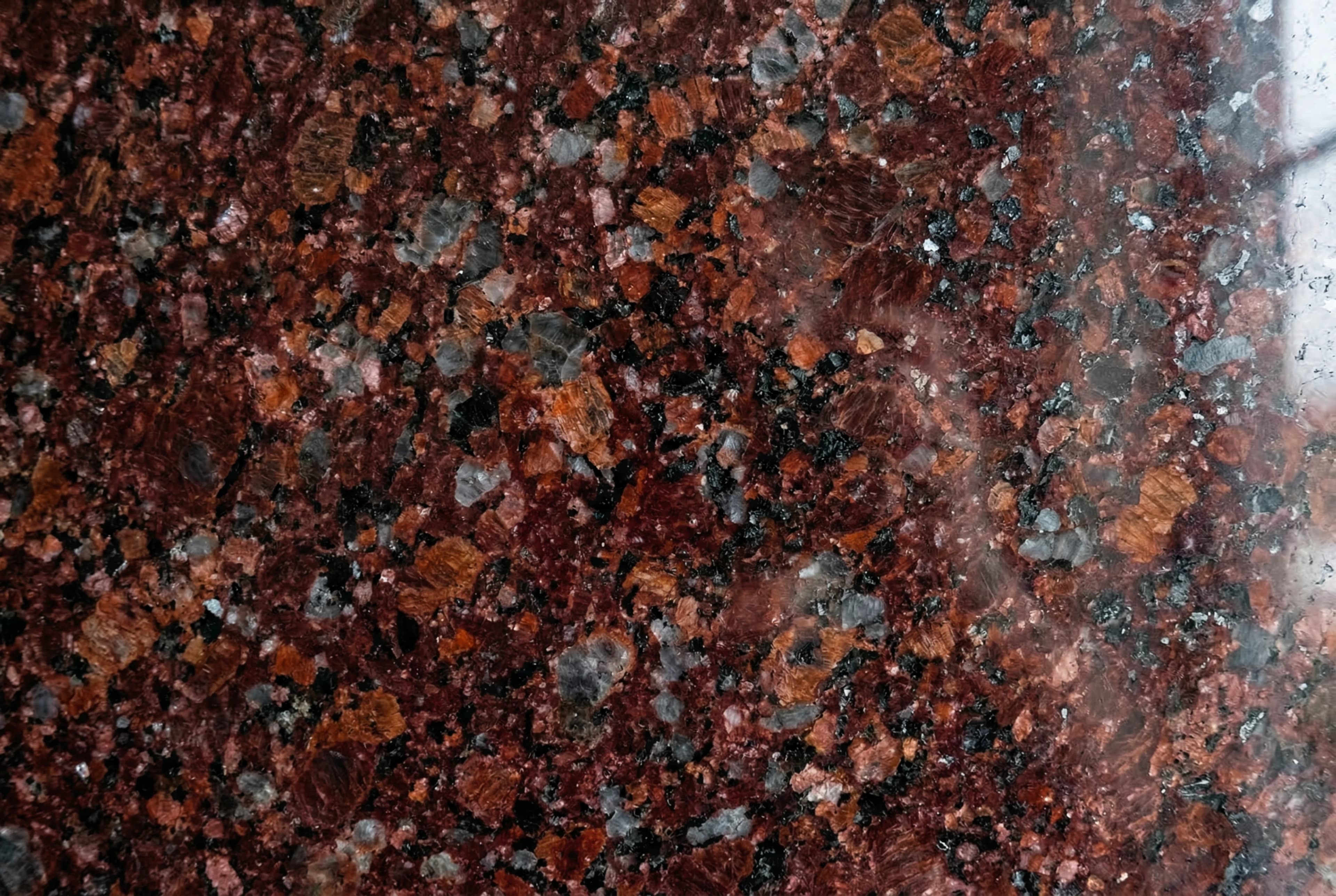 Текстура красный / бордовый гранит